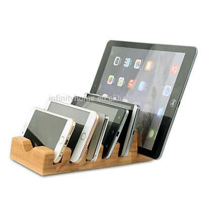 Simple cheap portable bamboo wooden phone docking station on desk